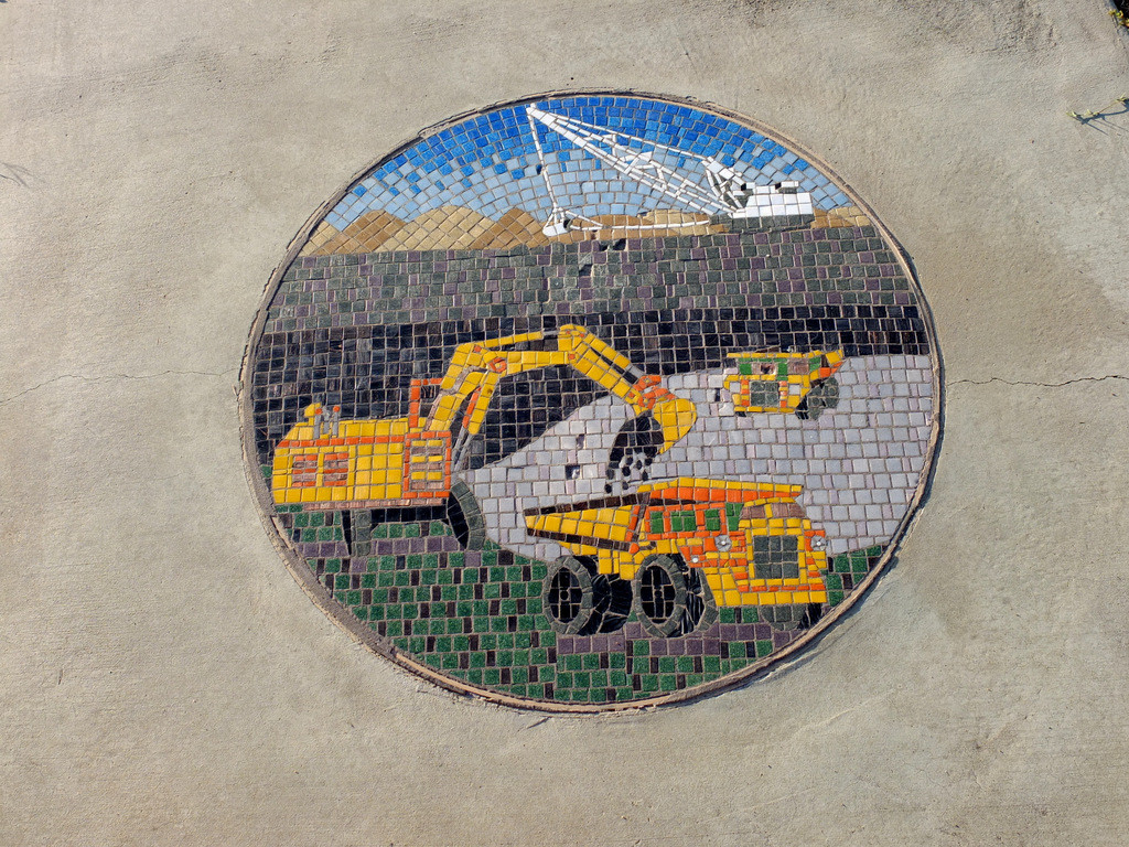 The communities pride in their coal mining is shown in this footpath mosaic in Emerald